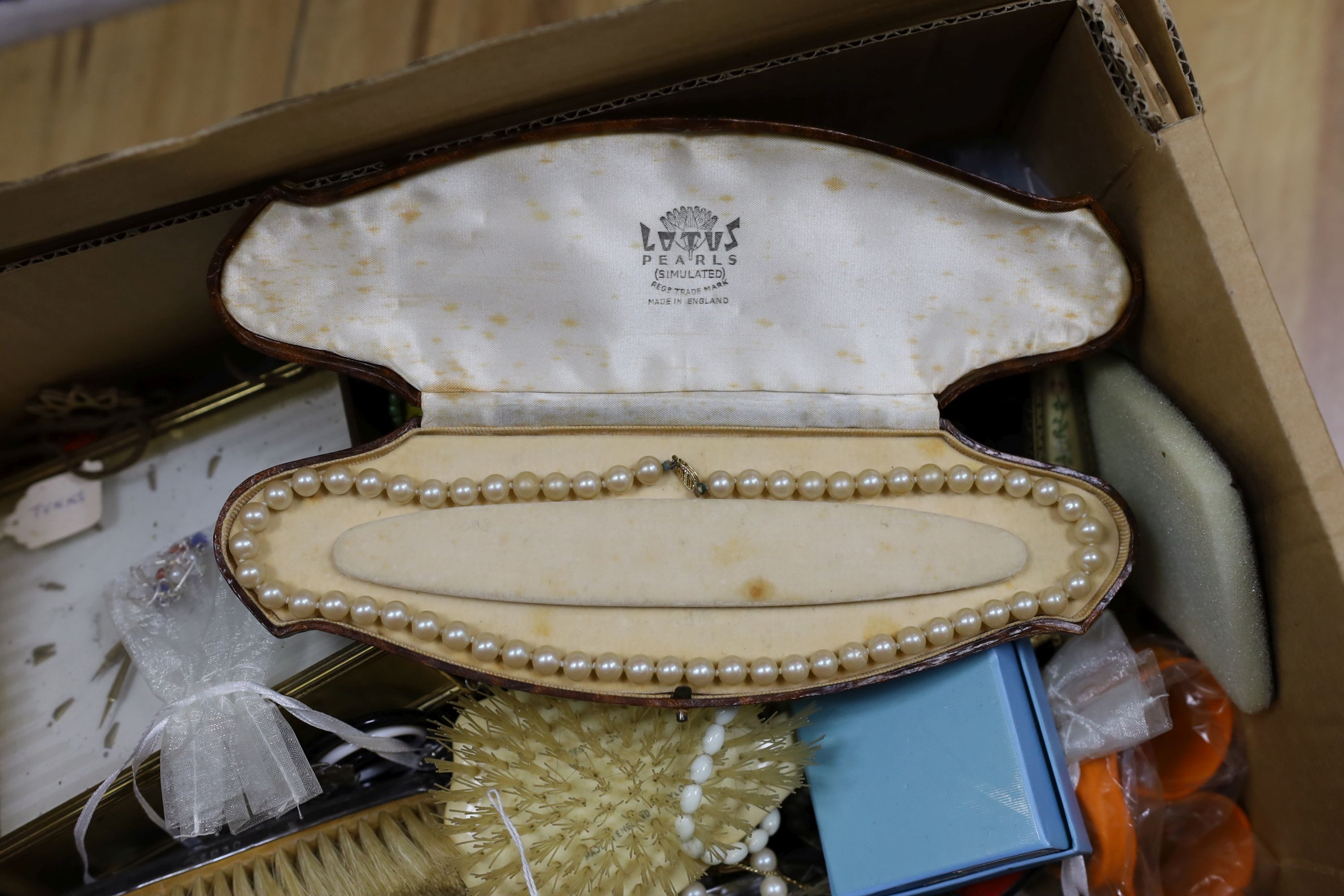 A large quantity of costume jewellery, clocks, watches, dressing table brushes etc.